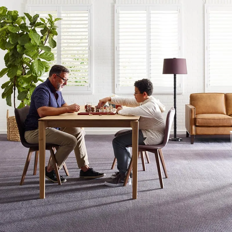 Kid playing chess with grandfather | Off-Price Carpet Outlet
